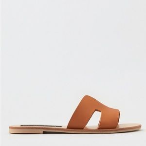 Brown leather slide sandals. Steve Madden